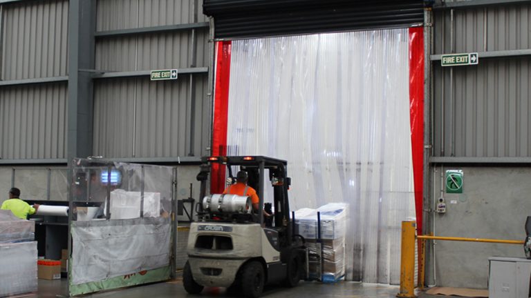 Forklift driving through PVC Strip Curtains, strip curtains